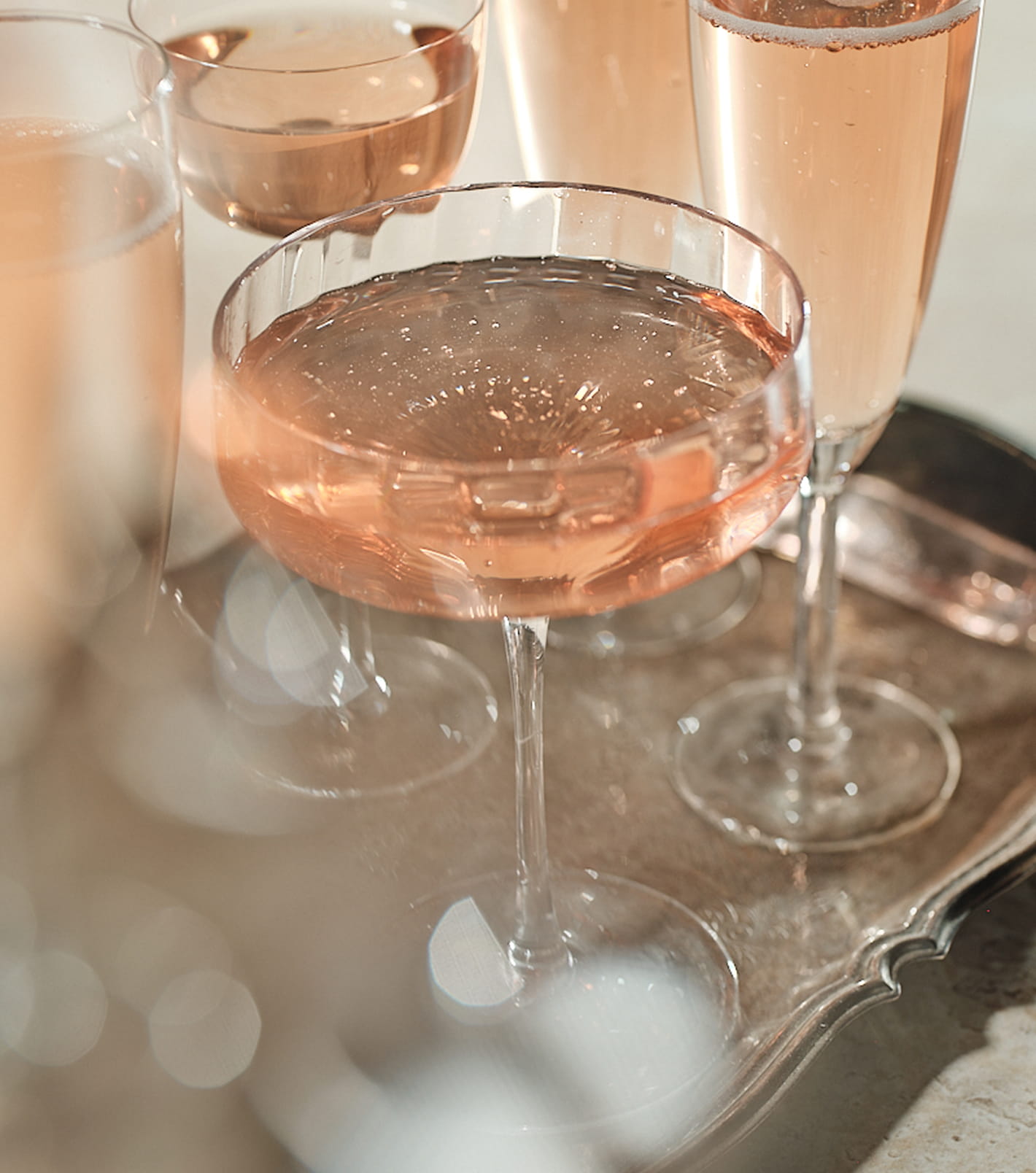 Purité Rosé pores out into glasses on an ornate